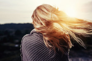 Blond woman in thought over marriage life with God.